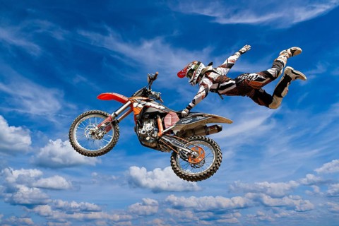 Motocross motorcycle and rider in the air