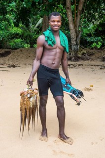Man presenting his fresh caught squid