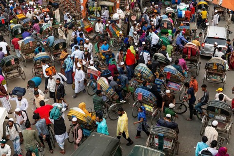 Completely with rickshaws overcrowded street in the center of Dhaka