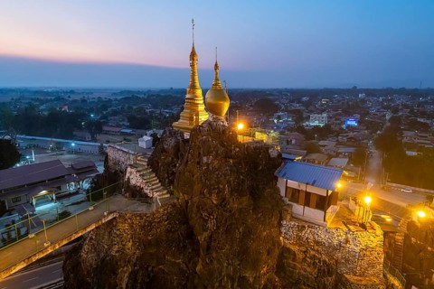 Taung Kew Paya built on rocks after sunset