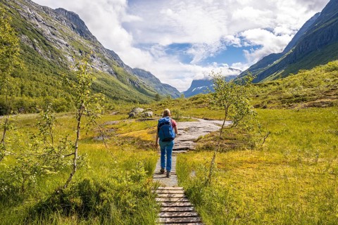 Hiker on a hiking trail to Innerdalstarnet