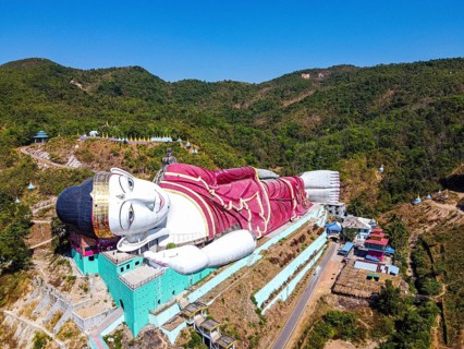 Aerial of a giant reclining buddha in Win Sein Taw Ya outside Mawlamyine