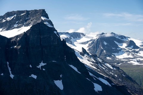 Snow covered mountain slope of Skarfjell mountain and Hesten