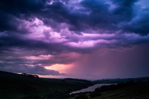 The colors of the storm with thunderbolts on night sky in Brecon Beacons National Park
