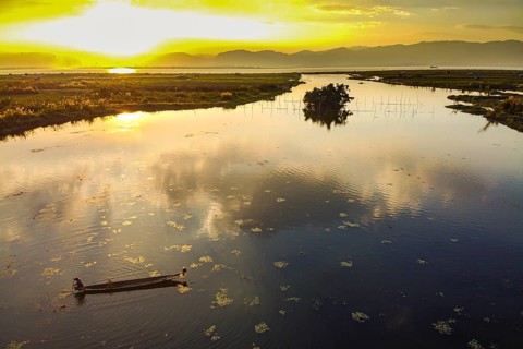 Rowing boat at sunset
