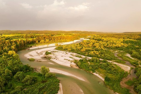 Isar in evening light with rain clouds