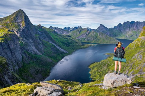 Hiker looking at fjord Forsfjorden
