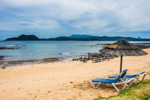 Sun lungers on a sandy beach of a four star hotel in Ilheu das Rolas