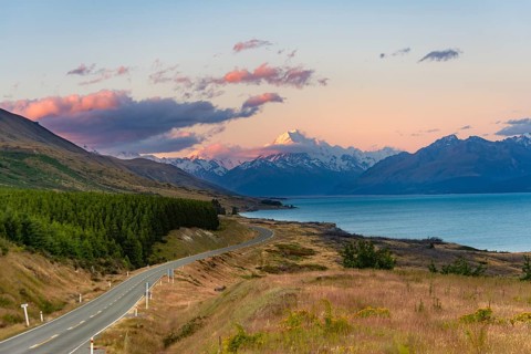 View of Mount Cook with road and lake