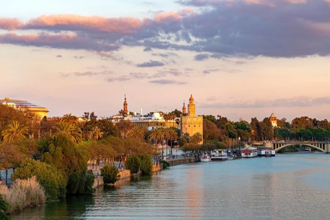 River Rio Guadalquivir with Torre del Oro and promenade