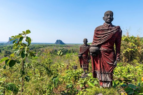 Huge line of monk statues in Win Sein Taw Ya outside Mawlamyine