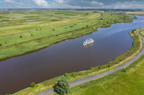 Drone shot with landscape at the Leyhoerner-Sieltief and tourist ship
