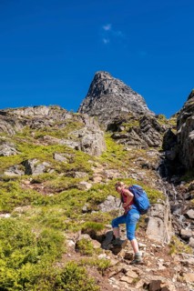 Hiking on a steep trail to Innerdalstarnet
