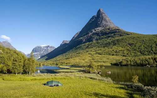 Tent on camping site by the lake Litlvatnet in the high valley Innerdalen