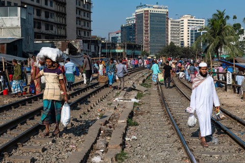 Street vendors on the railway tracks going through Kawran Bazar