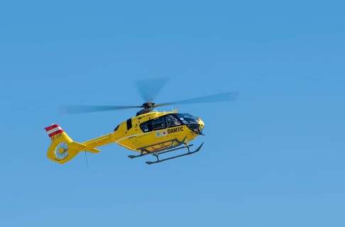 The OeAMTC rescue helicopter Christophorus 14 of the type Eurocopter 135 flies near its base in Oeblarn