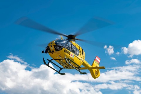 The OeAMTC rescue helicopter Christophorus 14 of the type Eurocopter 135 flies near its base in Oeblarn