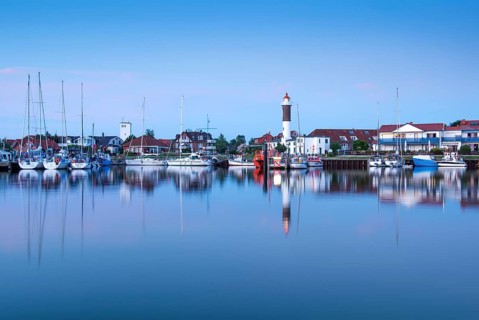 Timmendorf harbour with lighthouse in the evening