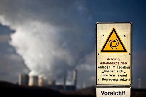 Sign with danger warning at the opencast mine Inden with power plant Weisweiler