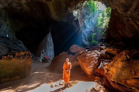 Monk standing in Saddan cave