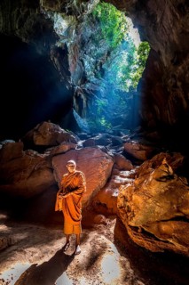 Monk standing in Saddan cave