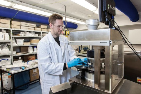 Scientists during their research work on a tablet press at the Institute for Pharmaceutical Technology and Biopharmacy at Heinrich-Heine-University Duesseldorf