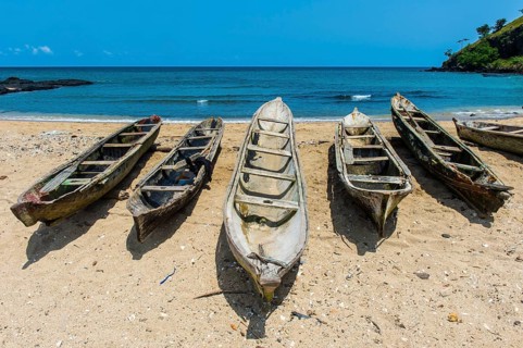 Wooden fishing boats in the fishing village Morro Peixe in northern Sao Tome