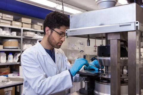 Scientists during their research work on a tablet press at the Institute for Pharmaceutical Technology and Biopharmacy at Heinrich-Heine-University Duesseldorf