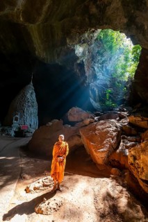 Monk standing in Saddan cave