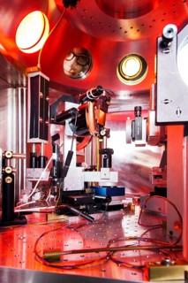 PhD student during his research work adjusting his experimental setup