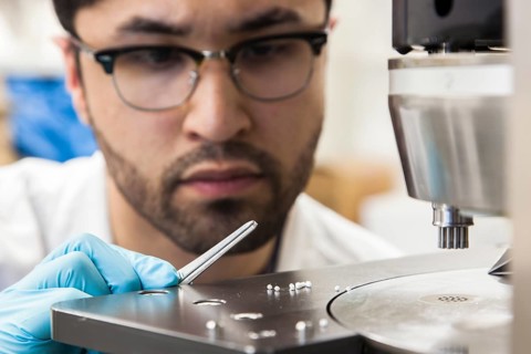 Scientists during their research work on a tablet press at the Institute for Pharmaceutical Technology and Biopharmacy at Heinrich-Heine-University Duesseldorf
