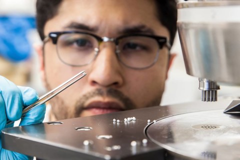 Scientists during their research work on a tablet press at the Institute for Pharmaceutical Technology and Biopharmacy at Heinrich-Heine-University Duesseldorf