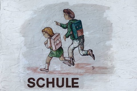 Mural with pupils at a schoolhouse