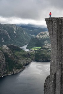 Person standing on steep cliff