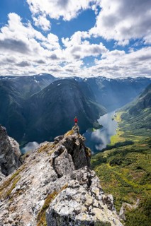 Hiker standing on rocky outcrop
