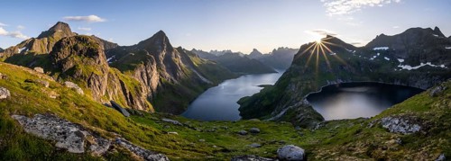Sun shining over mountain landscape with fjord Forsfjorden and lake Krokvatnet