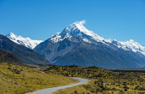 Country road overlooking snow-capped Mount Cook National Park