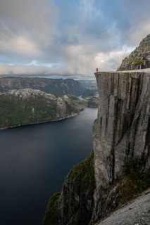 Person standing on steep cliff