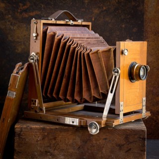 Old camera on brown background