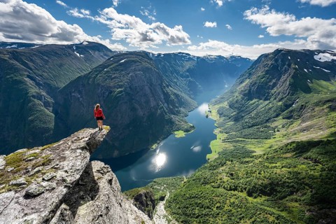 Hiker standing on rocky outcrop