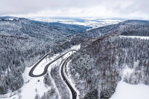 Winter snow road serpentine curves aerial photo near Albstadt curve