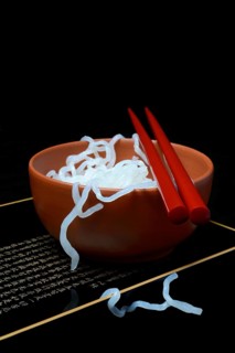 Shirataki noodles made from konjac flour in a bowl with chopsticks