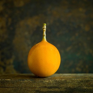 Grenadilla. Passion fruit on brown background