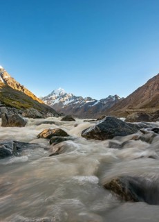 Hooker River in Hooker Valley with view of snow-capped Mount Cook