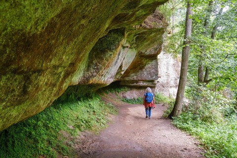 Woman walking on hiking trail in Schwarzachklamm