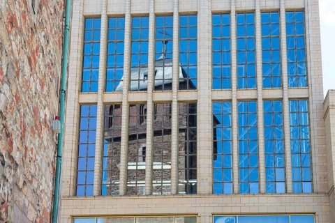 Reflection of the Red Tower in the glass facade of the Galerie Roter Turm