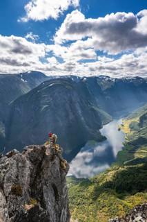 Hiker standing on rocky outcrop