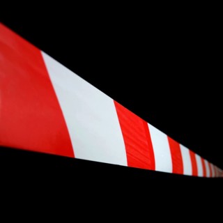 Red and white striped plastic hazard tape