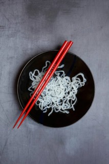Shirataki noodles made from konjac flour in a bowl with chopsticks