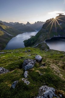 Sun shining over mountain landscape with fjord Forsfjorden and lake Krokvatnet